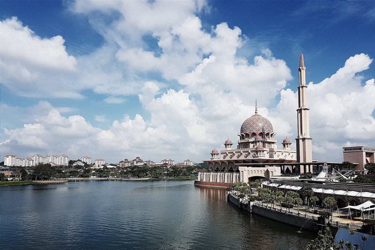 The pink dome of Putra Mosque on the lake at Putrajaya